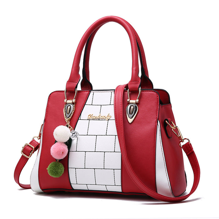 Phoebe | Two-tone shoulder bag with pompom charm