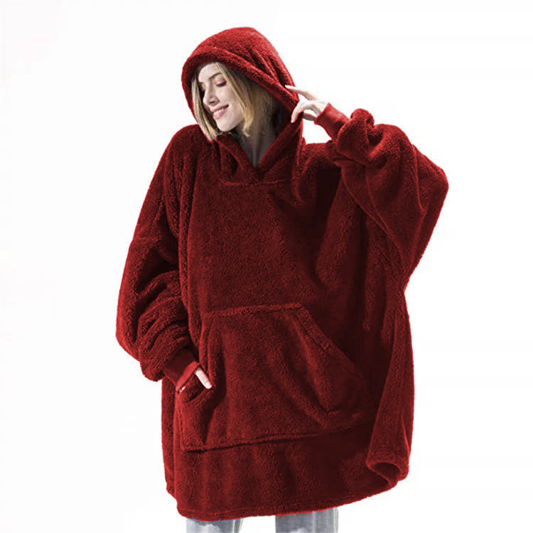 Person relaxing in an oversized blanket hoodie