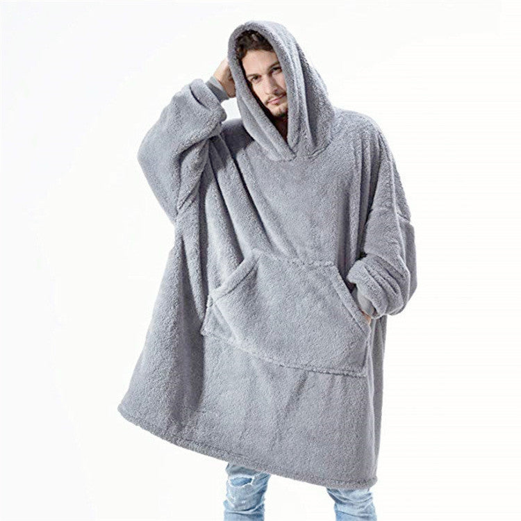 Person relaxing in an oversized blanket hoodie