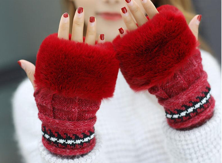 Woman in a knitted bobble hat with ear flaps