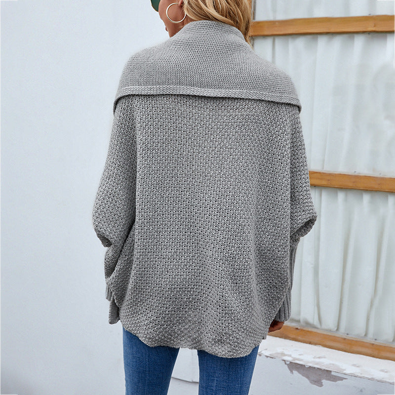 Woman in oversized chunky knit cardigan