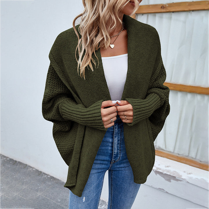 Woman in oversized chunky knit cardigan