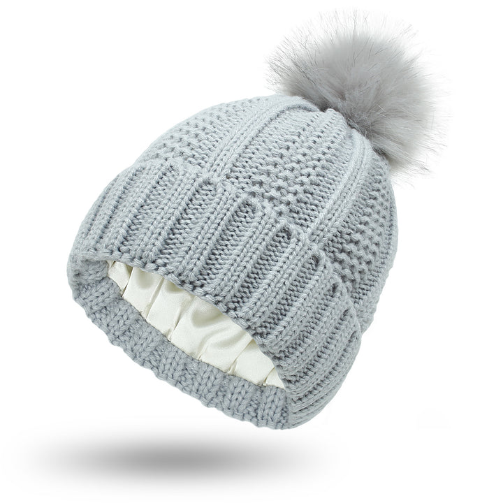 Chunky knit beanie with faux fur pom pom