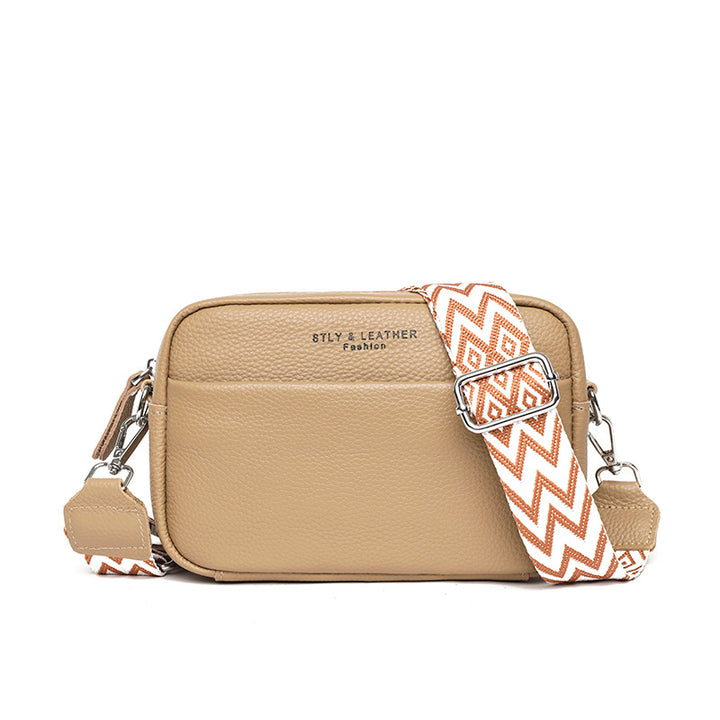Small leather crossbody bag with patterned strap