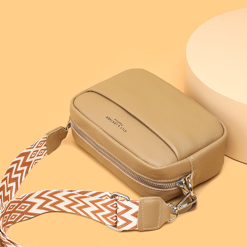 Small leather crossbody bag with patterned strap